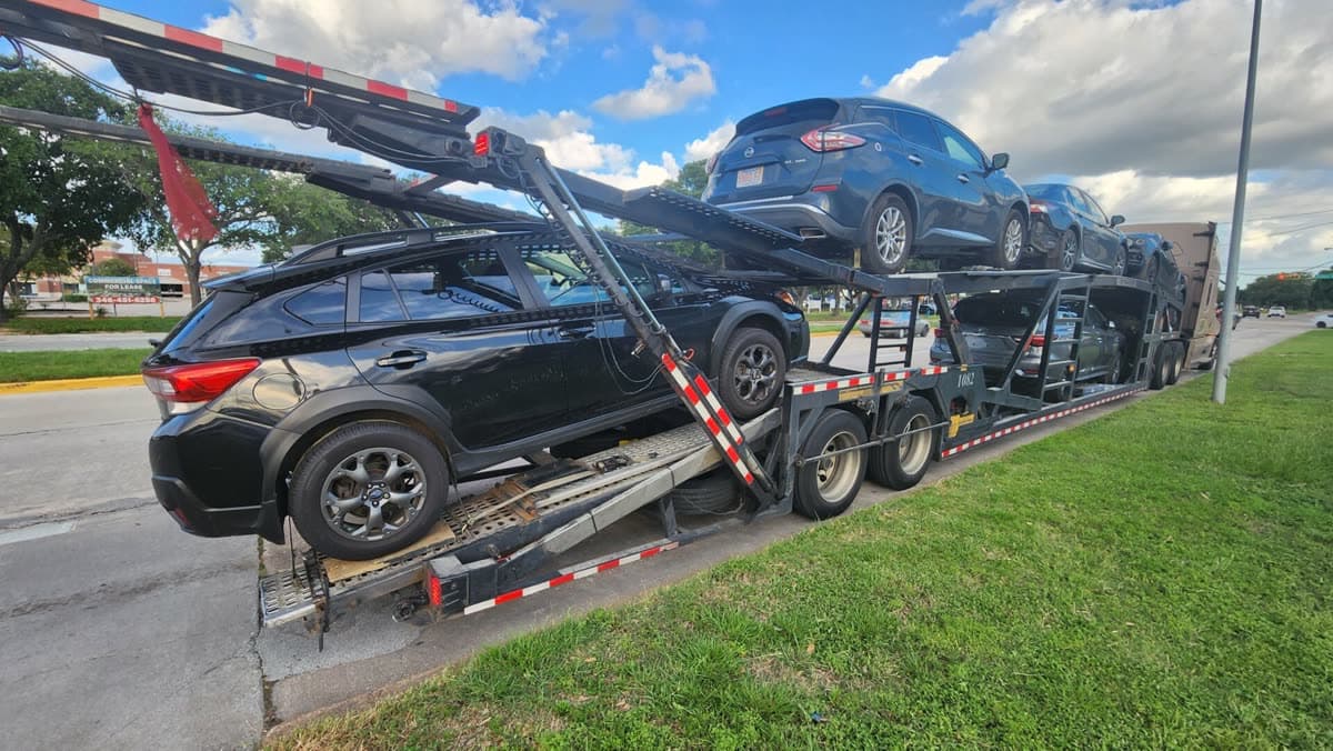 Open car carrier used for a Katy, TX to Bayside, NY vehicle shipment