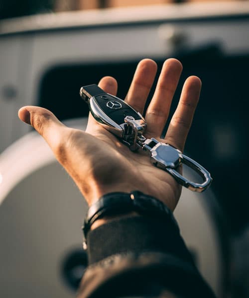 Customer handing off vehicle key for auto transport