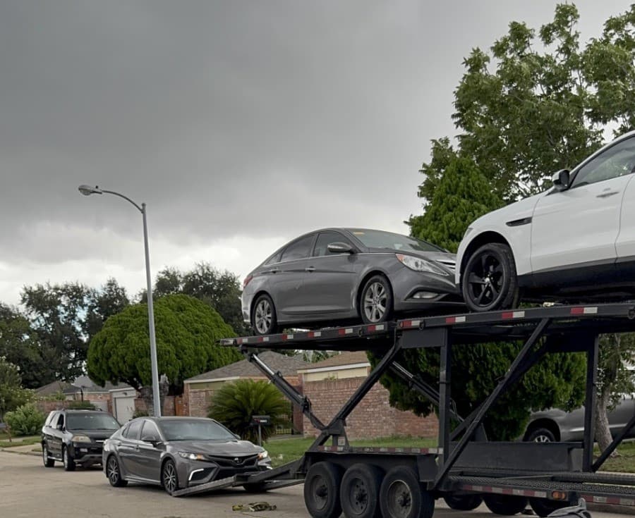 2024 Toyota Camry loaded on an open auto transport carrier in Houston, TX